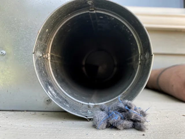 Montebello Dryer Vent Cleaning technician using specialized equipment to clear severe dryer vent blockage in Montebello